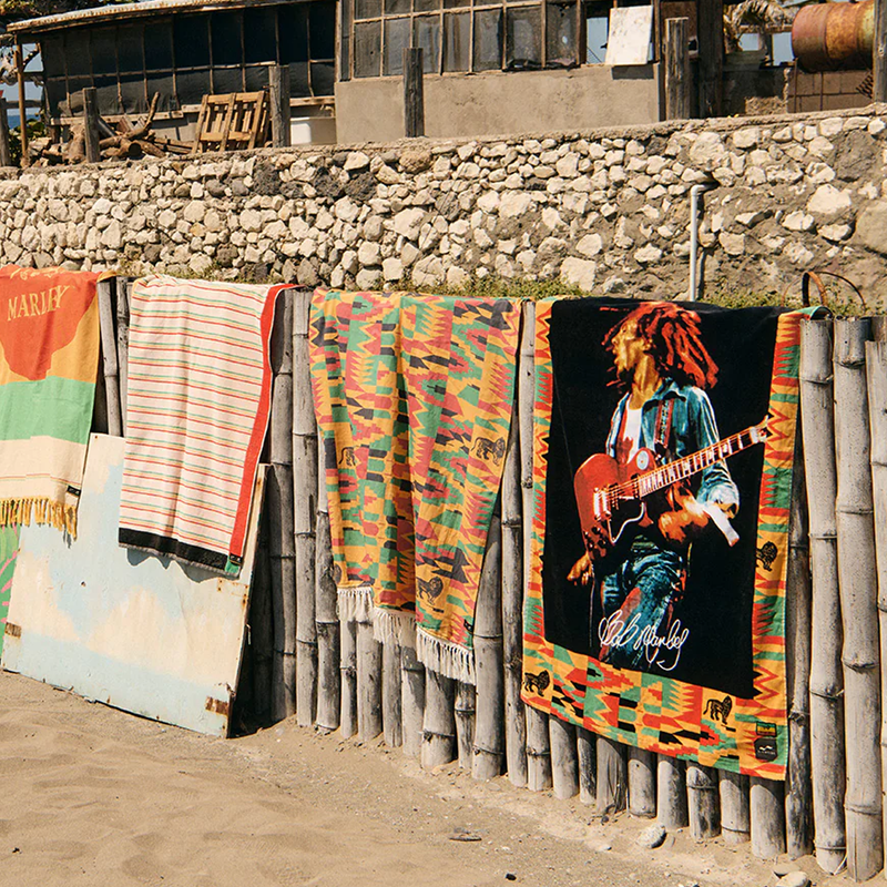 Bob Marley x Slowtide Trenchtown Beach Towel, Slowtide Beach Towel over fence