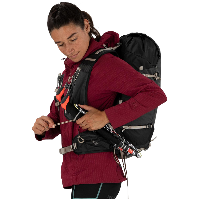 Women's Tempest Velocity 30, Osprey Women's Tempest Velocity 30 in Pashmina/Melon on model trekking pole straps