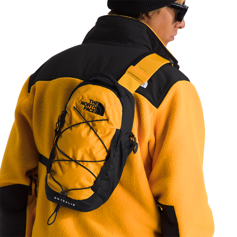 Borealis Sling, The North Face Borealis Sling in ZU3-Summit Gold/TNF Black on model
