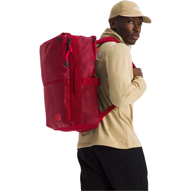 Base Camp Voyager Daypack, The North Face Base Camp Voyager Daypack in Beetroot TNF Red on model