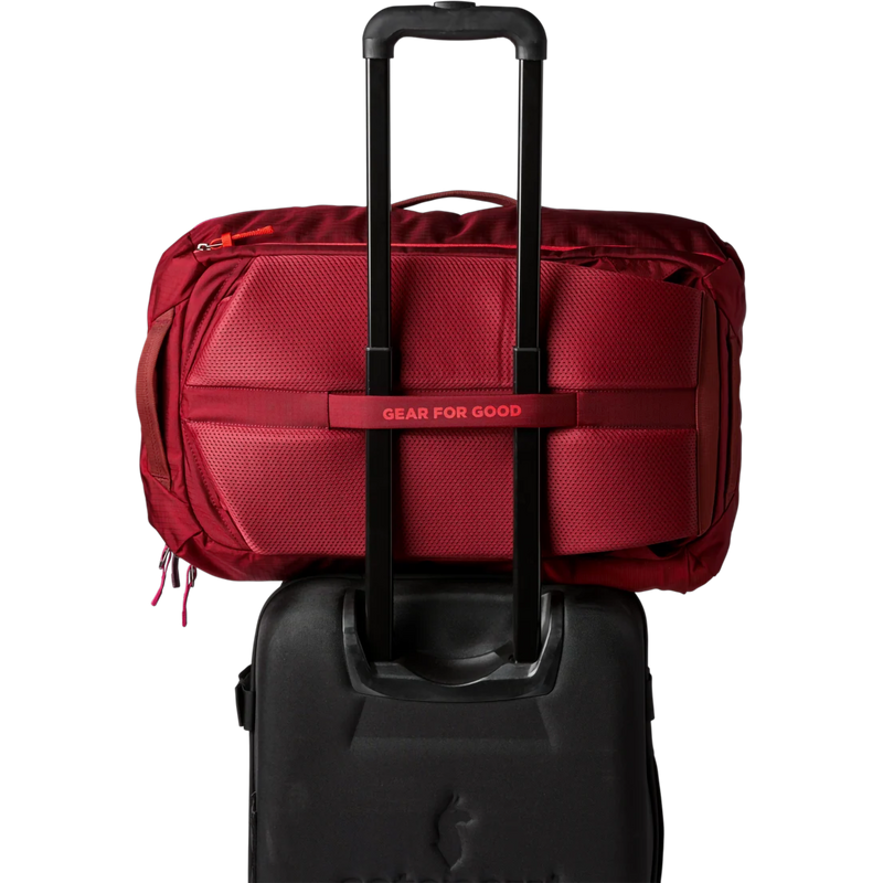 Allpa 35L Travel Pack, Cotopaxi Allpa 35L Travel Pack in Crimson on luggage handle