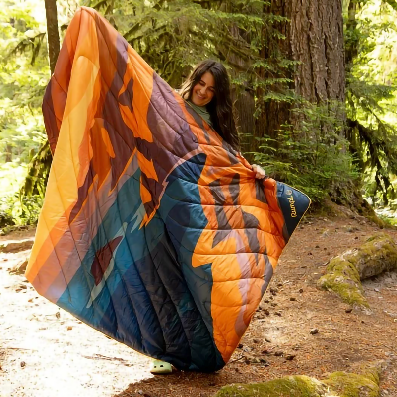 The Original Puffy Blanket, Rumpl The Original Puffy Blanket in Big Sur Fade with model outside