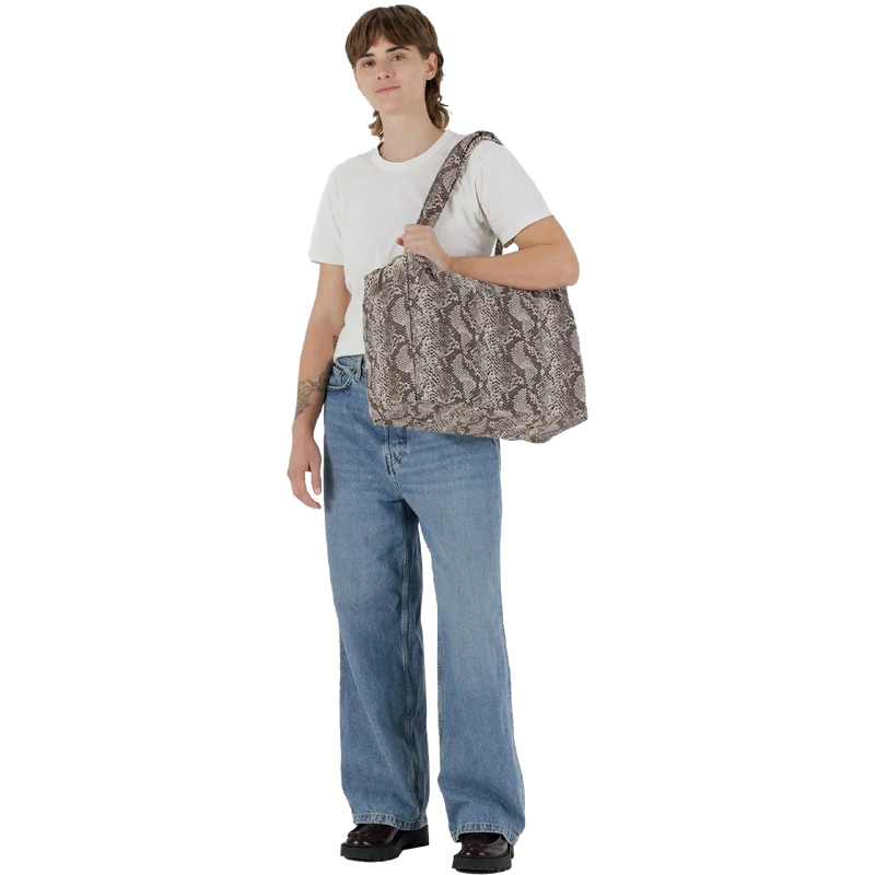 Small Cloud Carry-On, BAGGU Small Cloud Carry-On with traveler