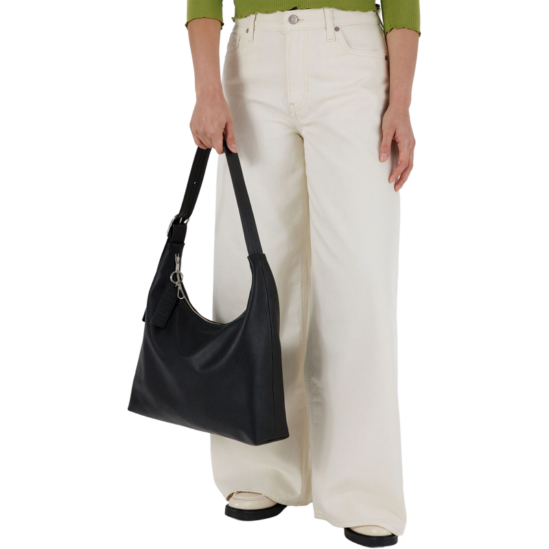 Recycled Leather Shoulder Bag, BAGGU Recycled Leather Shoulder Bag held by strap 