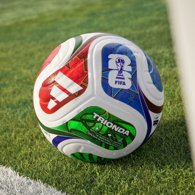 World Cup Trionda Competition Ball, Adidas World Cup Trionda Competition Ball in White/Solar Blue/Hi-Res Red/Flash Lime on field grass