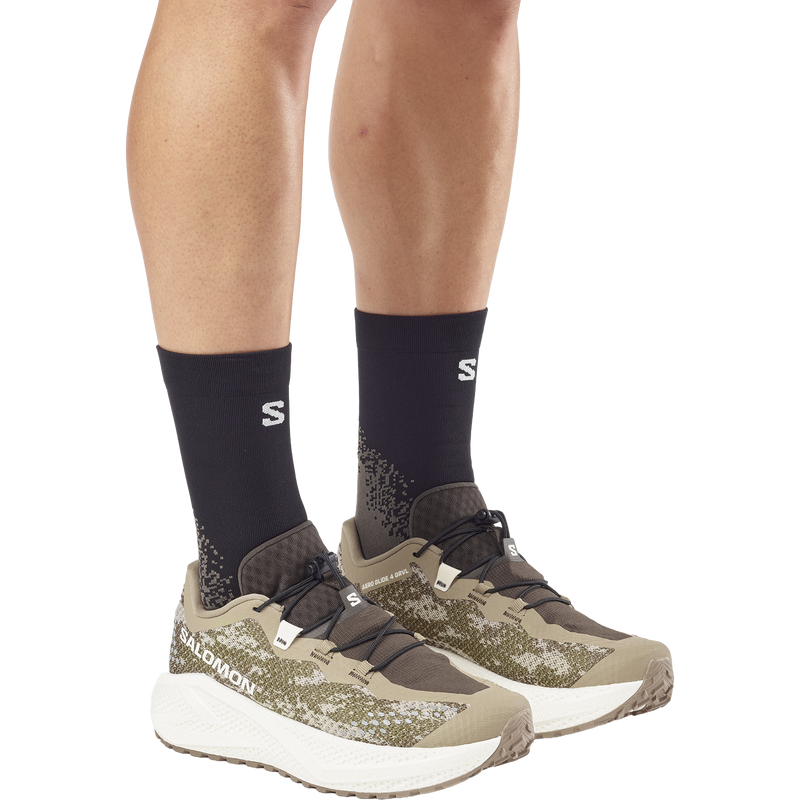 Men's Aero Glide 4 Grvl, Salomon Men's Aero Glide 4 Grvl in Safari/Vanilla Ice/Earth pair front right on model