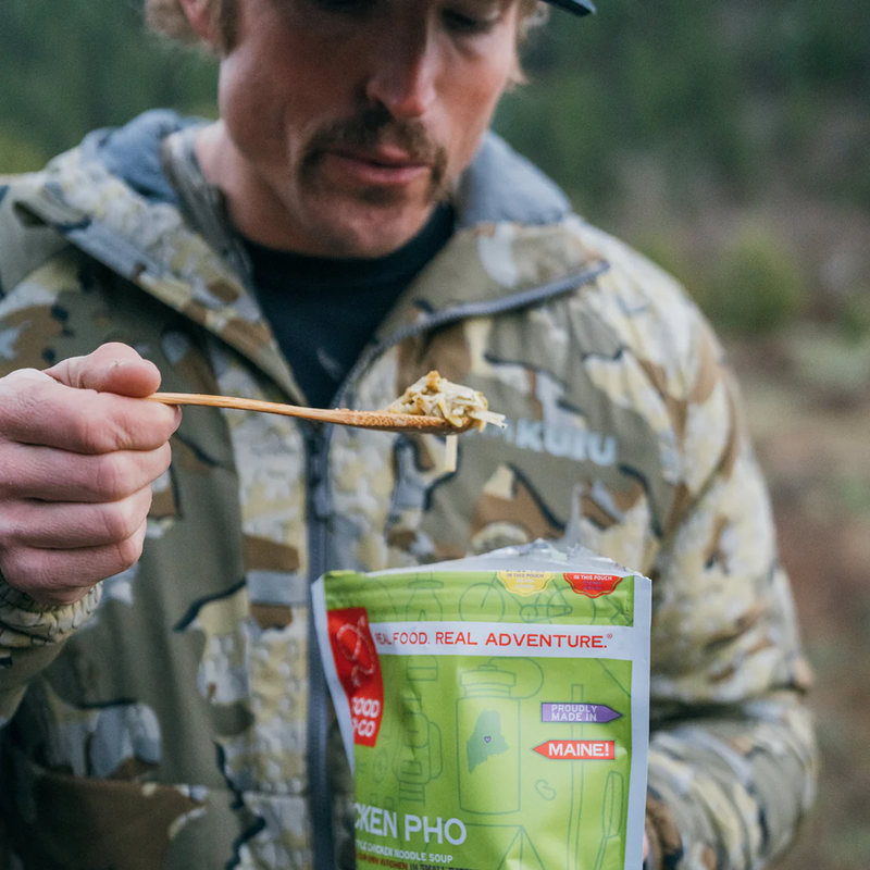 Essential 5-Day Emergency Food Kit, Good To-Go Essential 5-Day Emergency Food Kit Chicken Pho in hand