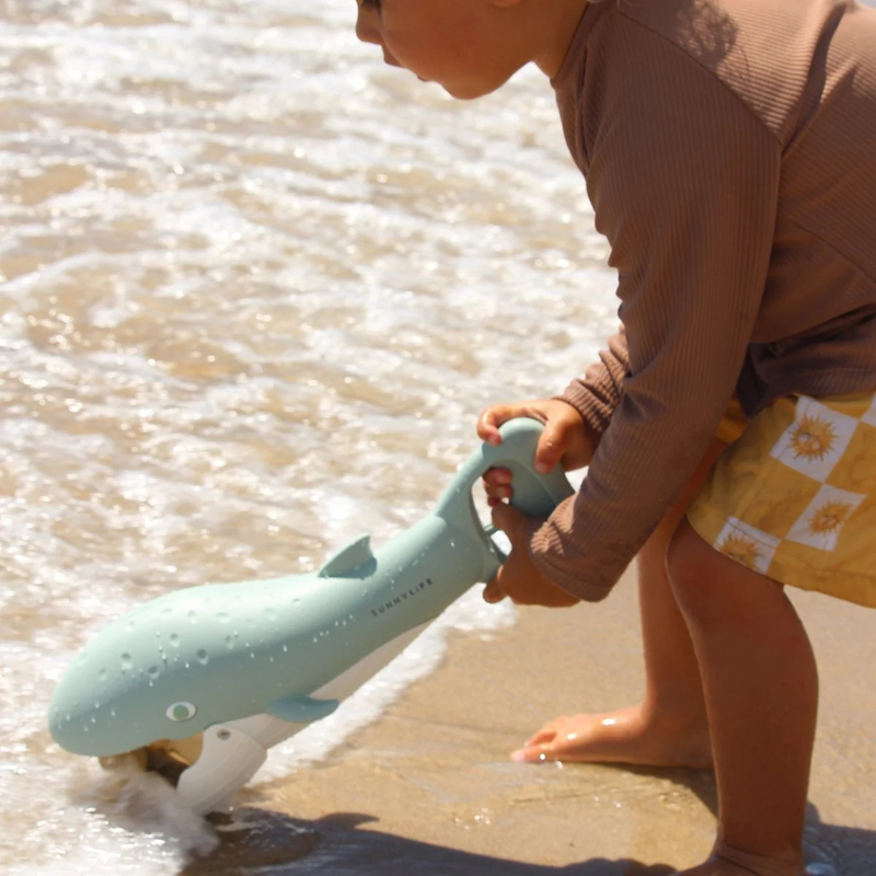 Sand Claws Whale, Sunnylife Sand Claws Whale in Green with model on beach