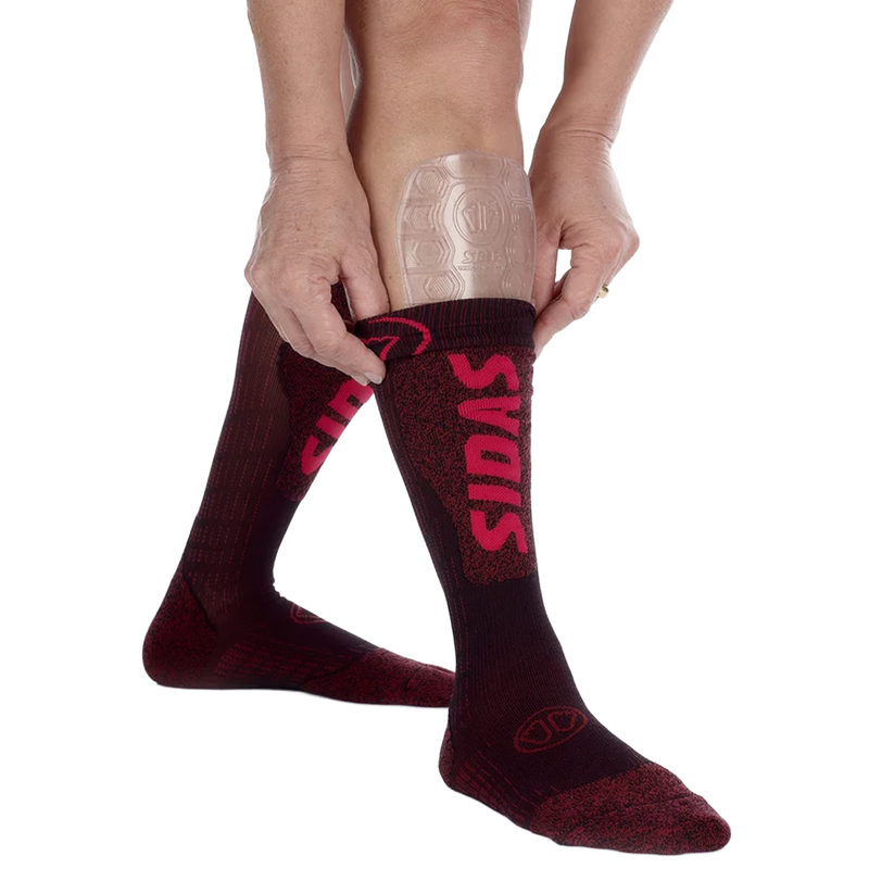 Sidas Gel Tibial Evo Shin Protector pair on shins with socks being pulled up