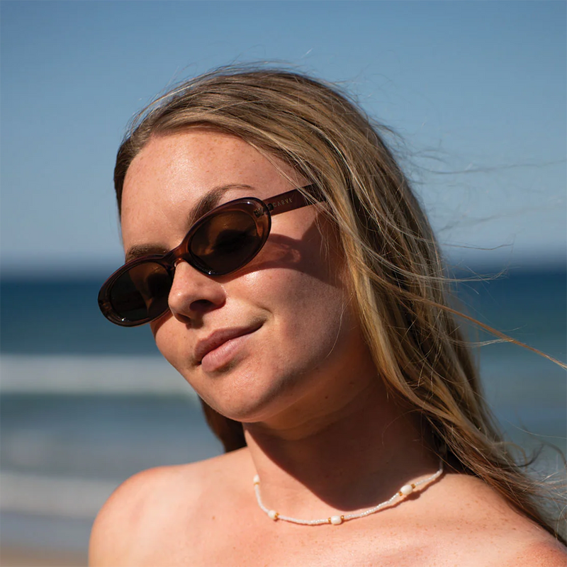 Esme, Carve Esme in Gloss Tort with Brown lens on model