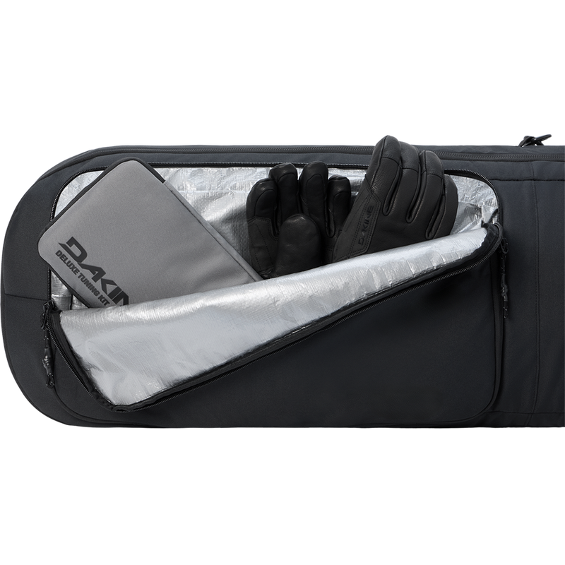 Dakine Tour Snowboard Bag front pocket storage with tuning kit and gloves for packing example