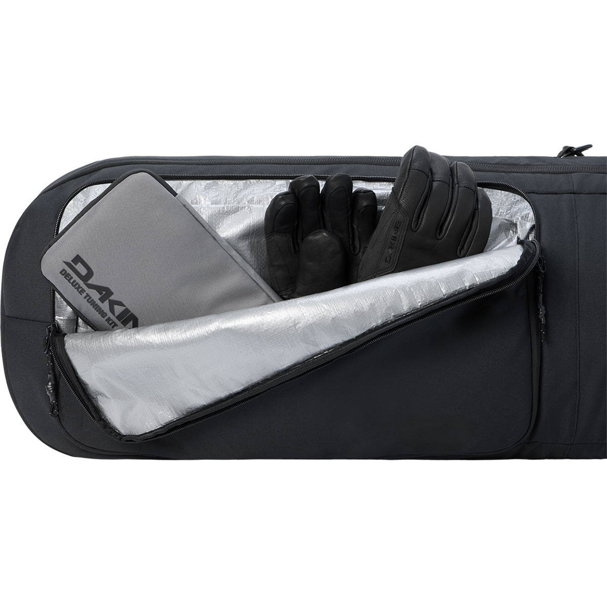 Dakine Tour Snowboard Bag front pocket storage with tuning kit and gloves for packing example
