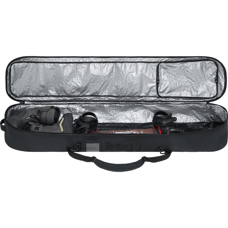 Dakine Tour Snowboard Bag packed with board and boots as example showing space