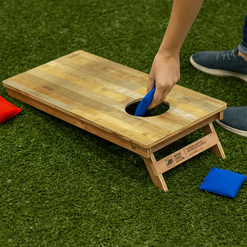 Backyard 1200 Cornhole Boards, American Cornhole Association Backyard 1200 Cornhole Boards in Classic Stripes Natural Wood Blues on grass with model