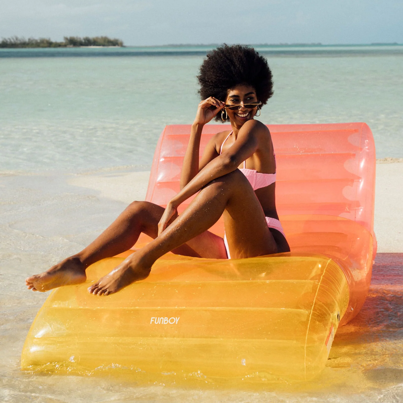 Chaise Lounger Pool Float, Funboy Chaise Lounger Pool Float in Clear Rainbow on beach with model