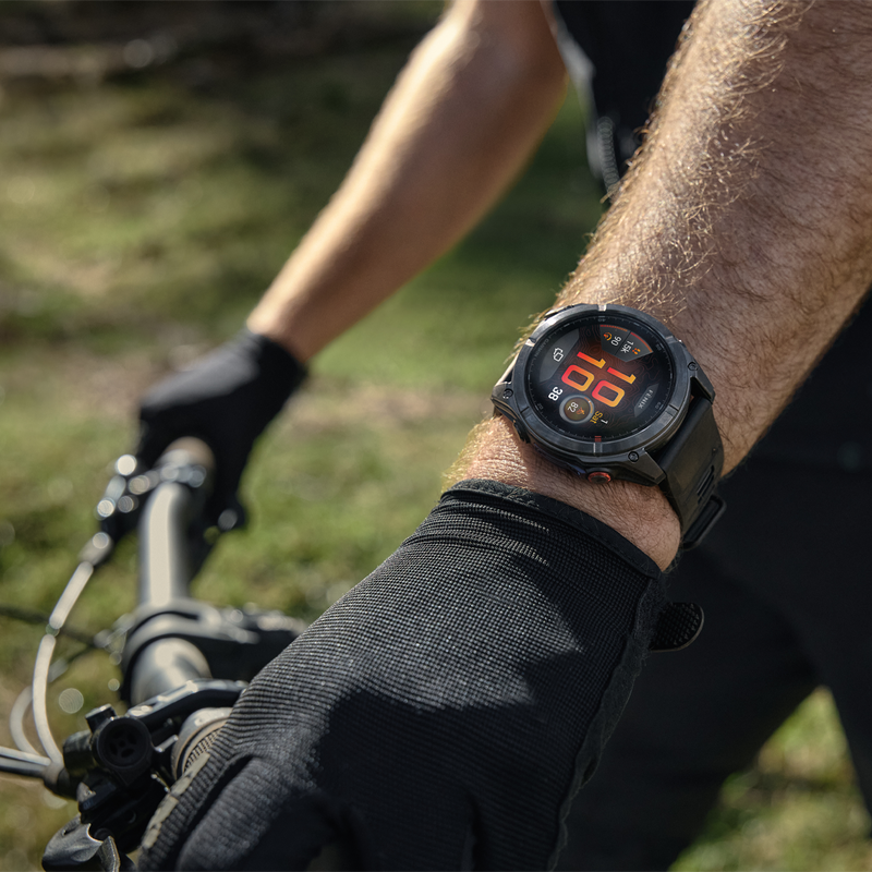 Fenix 8 Pro Sapphire 51mm Titanium w/ Graphite, Garmin Fenix 8 Pro Sapphire 51mm Titanium Graph on bike rider