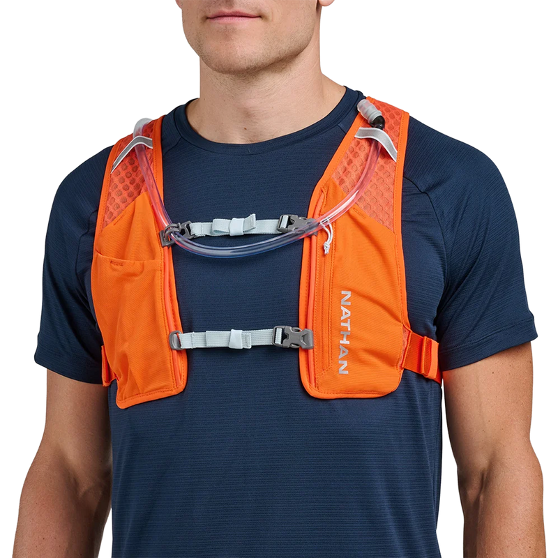 Quick Start 3.0 6L Hydration Pack, Nathan Quick Start 3.0 6L Hydration Pack in Orange Blaze Reflective Silver on model