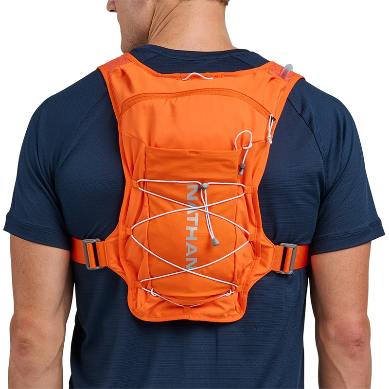 Quick Start 3.0 6L Hydration Pack, Nathan Quick Start 3.0 6L Hydration Pack in Orange Blaze Reflective Silver on model back view
