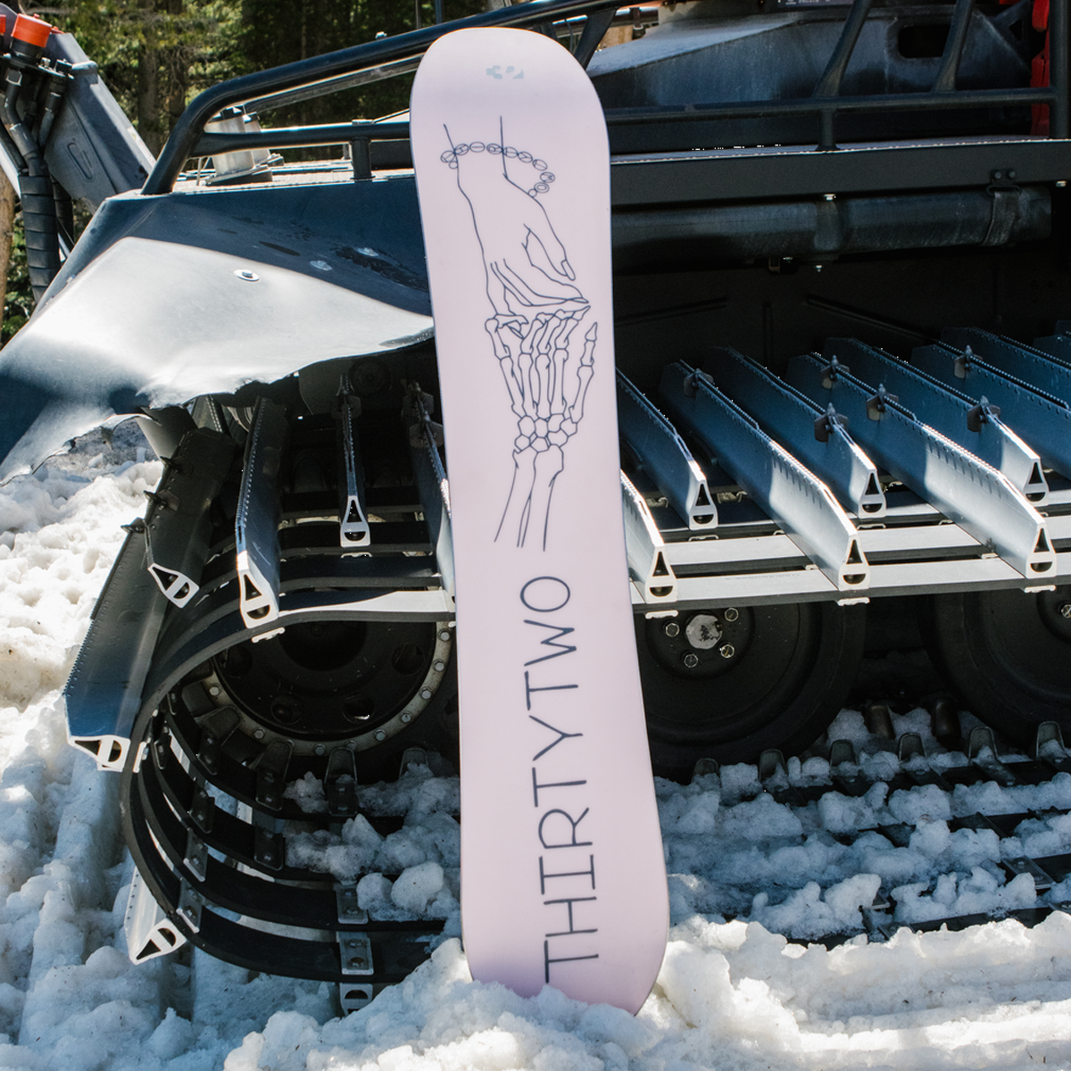 ThirtyTwo Women's Crucible outside photography shot of snowboard base leaning on snowcat