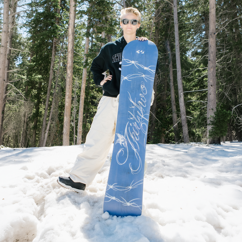 ThirtyTwo Women's Gemini outdoor photography team rider with base facing toward camera in snow