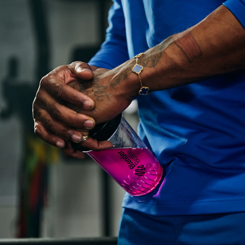 Essential Aminos (Single Serving), Gnarly Sports Nutrition Essential Aminos Berry Lemonade + Caffeine mixed in water bottle