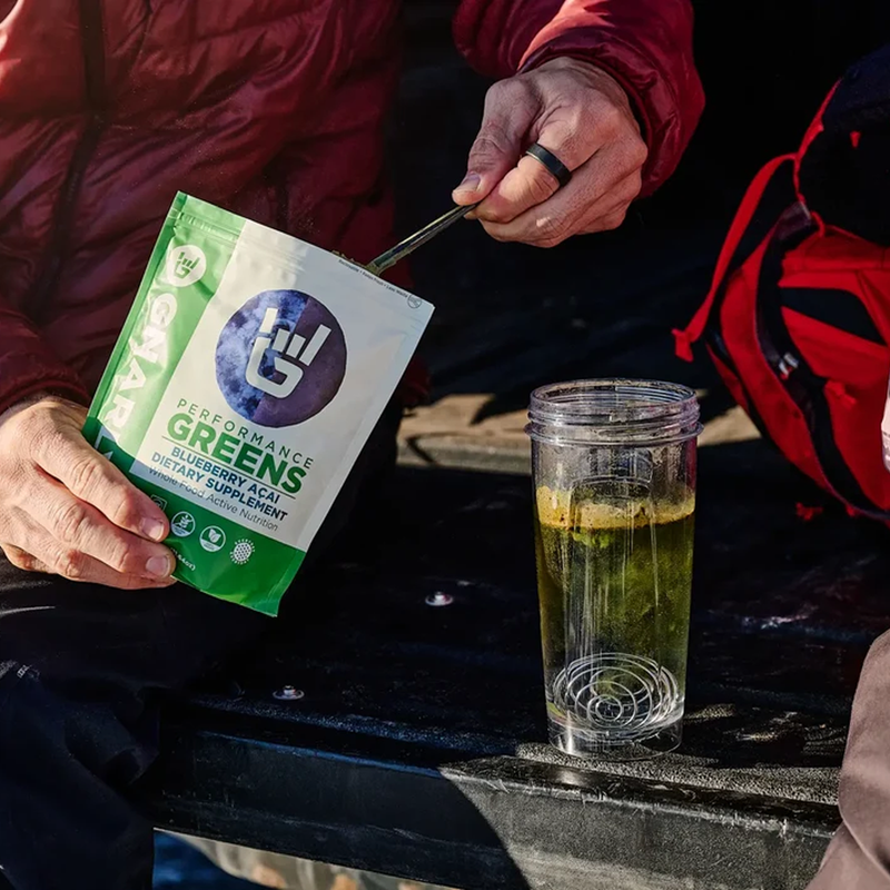 Performance Greens (30 Servings), Gnarly Sports Nutrition Performance Greens (30 Servings) in hand