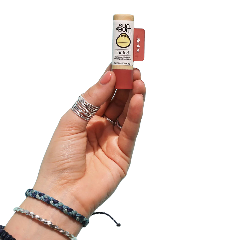 SPF 15 Tinted Lip Balm, Sun Bum SPF 15 Tinted Lip Balm held by model